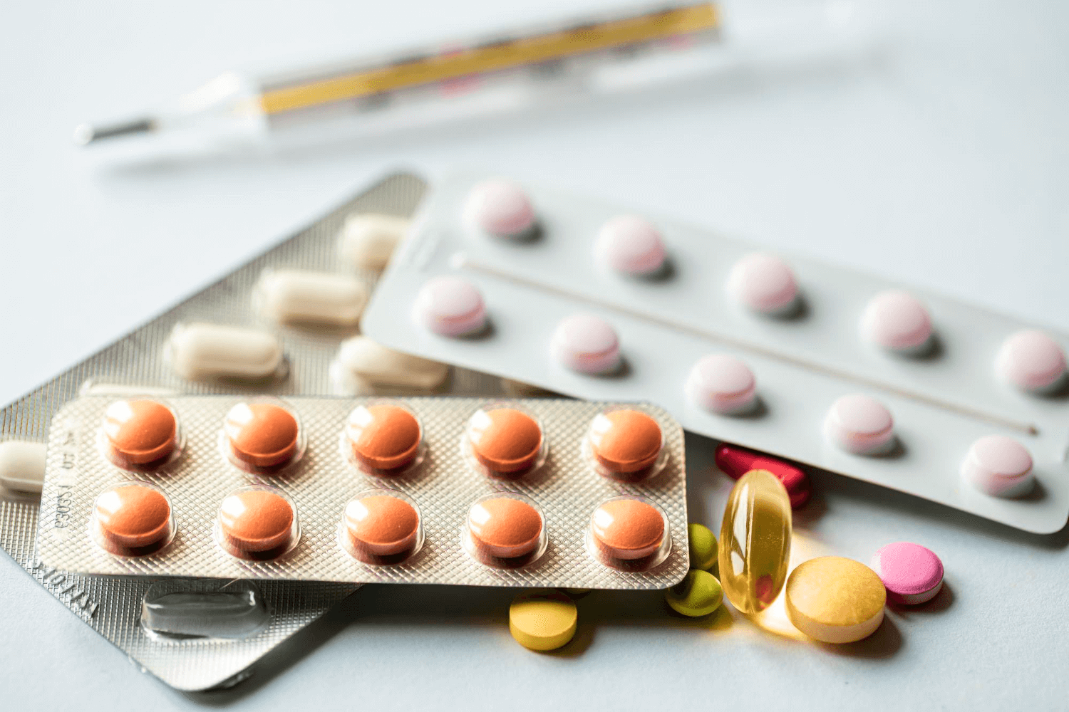 modcloseup-assorted-pills-white-background